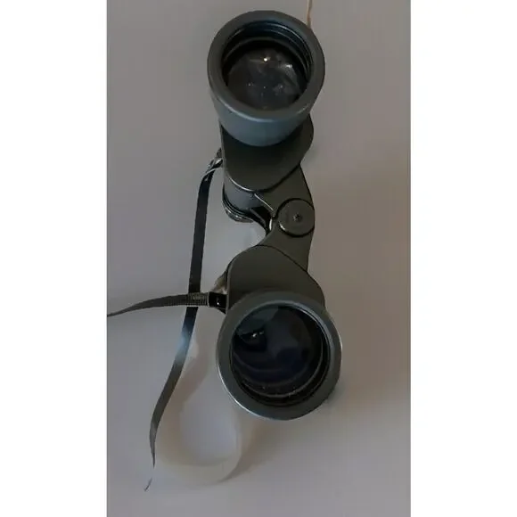 BUSHNELL 13–2140 K, 288ft @ 1000 YDS @ 7X POWER ZOOM BINOCULAR W/Carrying Bag
